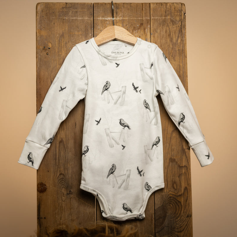 Patterned snap-button long-sleeved baby bodysuit